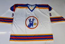 Load image into Gallery viewer, A white hockey jersey with blue and orange stripes on the shoulders, sleeves, and hem, featuring the circular Winnipeg Jets logo on the chest.